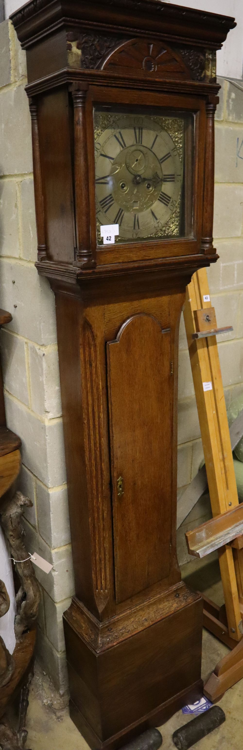 A George III oak eight day longcase clock, brass and silvered dial marked Mercer Hythe, height 218cm